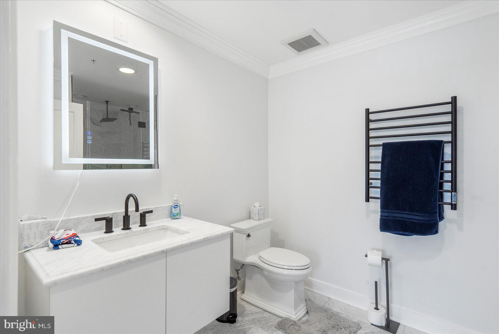 801 Key Highway, Unit T63 Baltimore, MD 21230 - Photo 7 of 43 a bathroom with a sink toilet and mirror