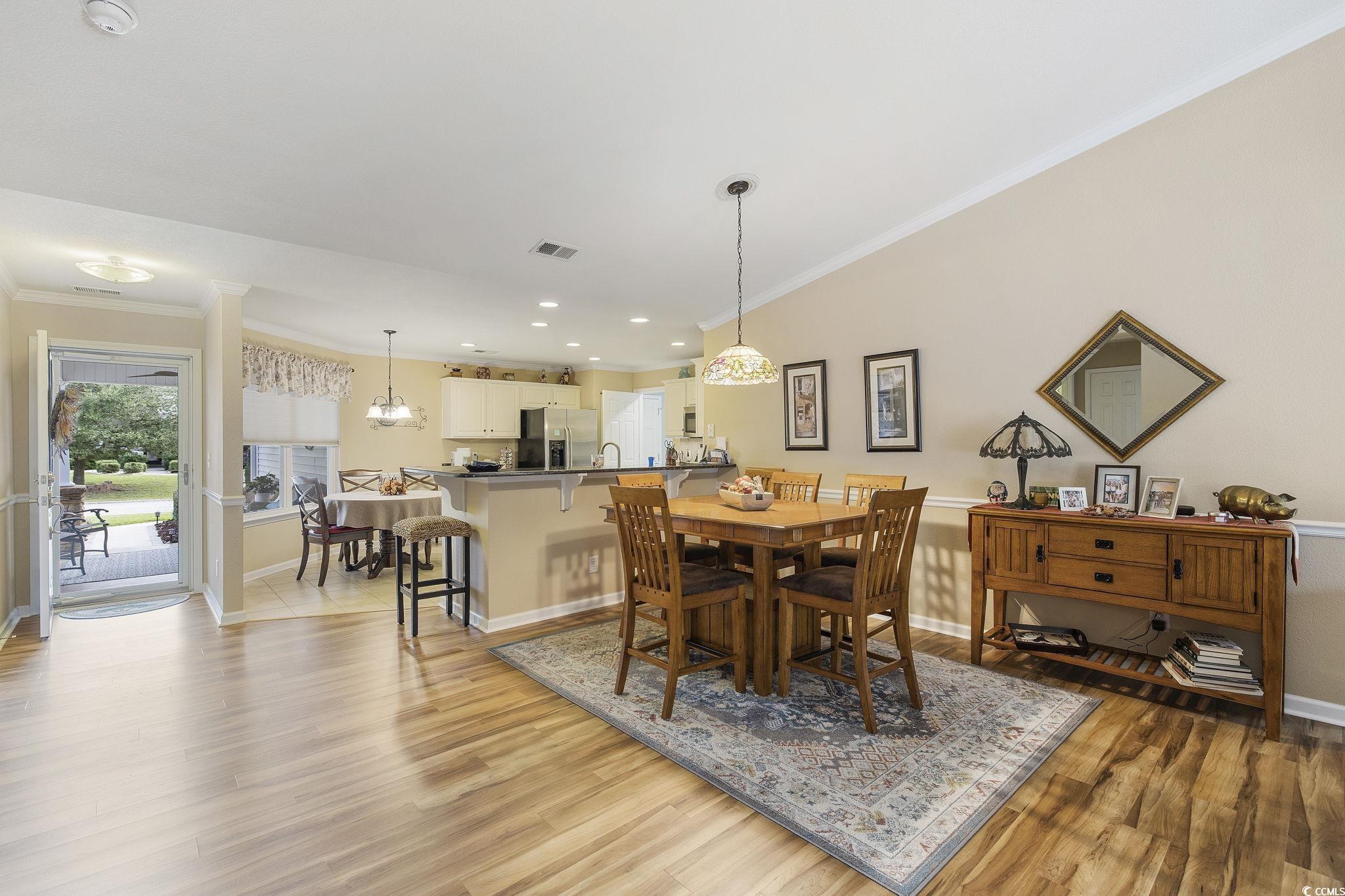 749 Bonita Loop Myrtle Beach, SC 29588 - Photo 13 of 37 Dining area with lofted ceiling, a notable chandel