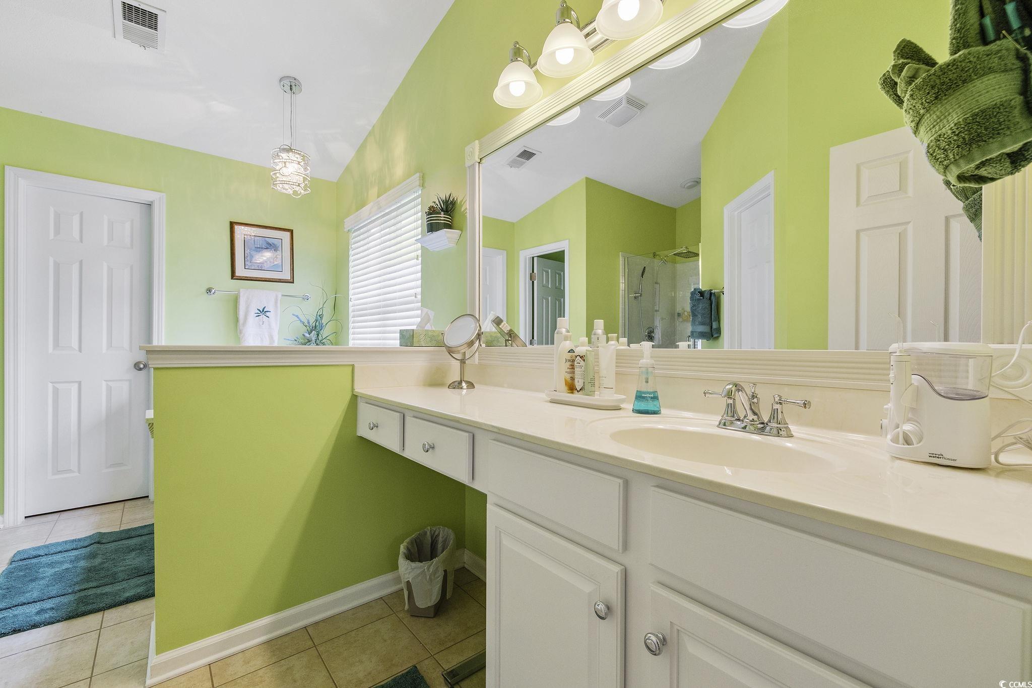 749 Bonita Loop Myrtle Beach, SC 29588 - Photo 20 of 37 Bathroom featuring vanity, lofted ceiling, a showe