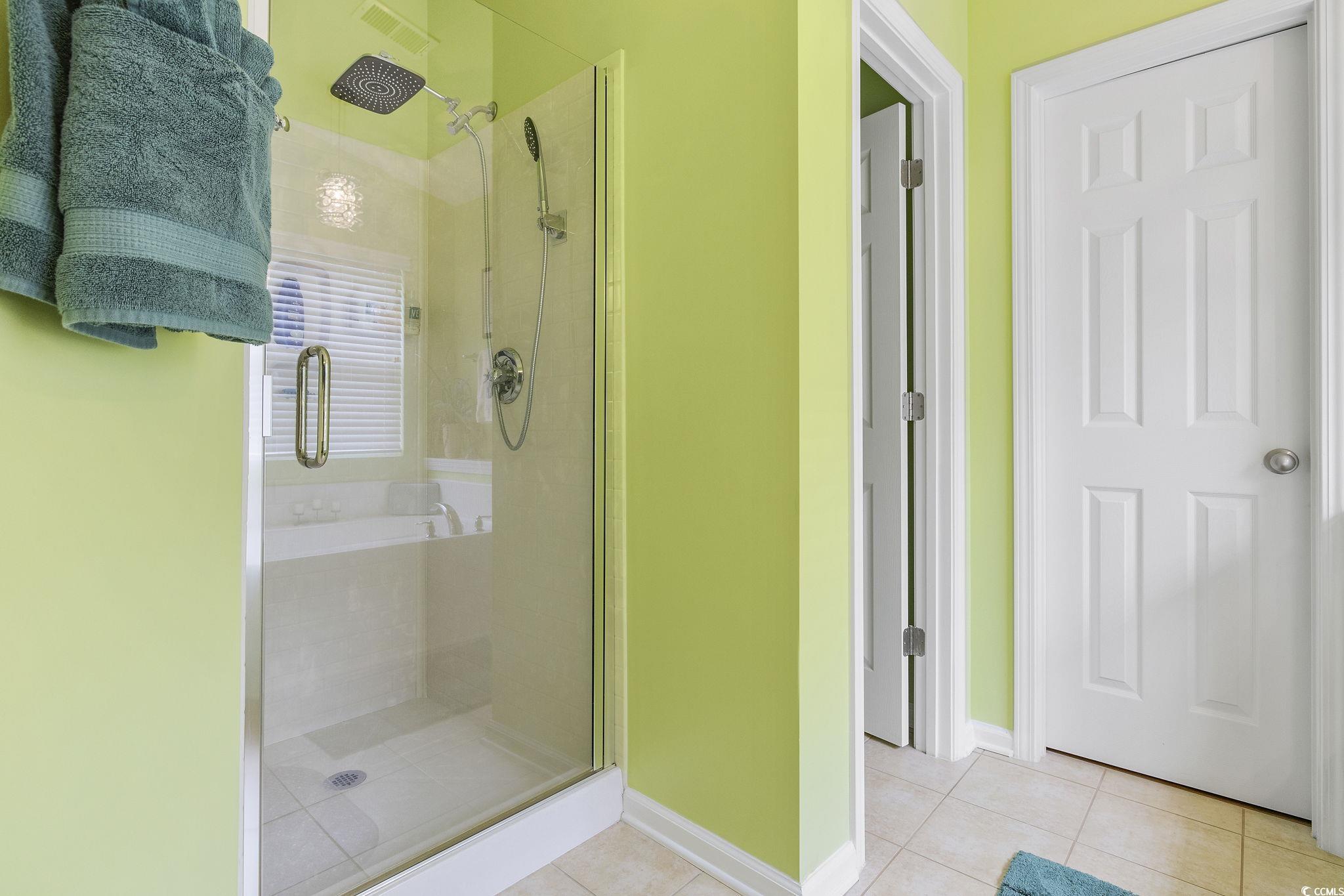 749 Bonita Loop Myrtle Beach, SC 29588 - Photo 21 of 37 Bathroom with tile patterned flooring and an enclo