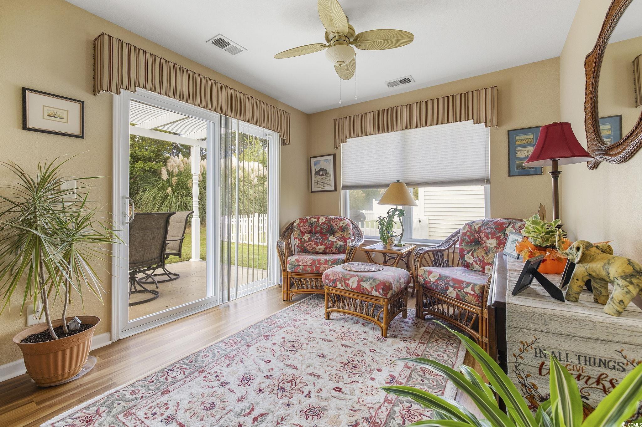 749 Bonita Loop Myrtle Beach, SC 29588 - Photo 26 of 37 Living area with ceiling fan, light hardwood / woo