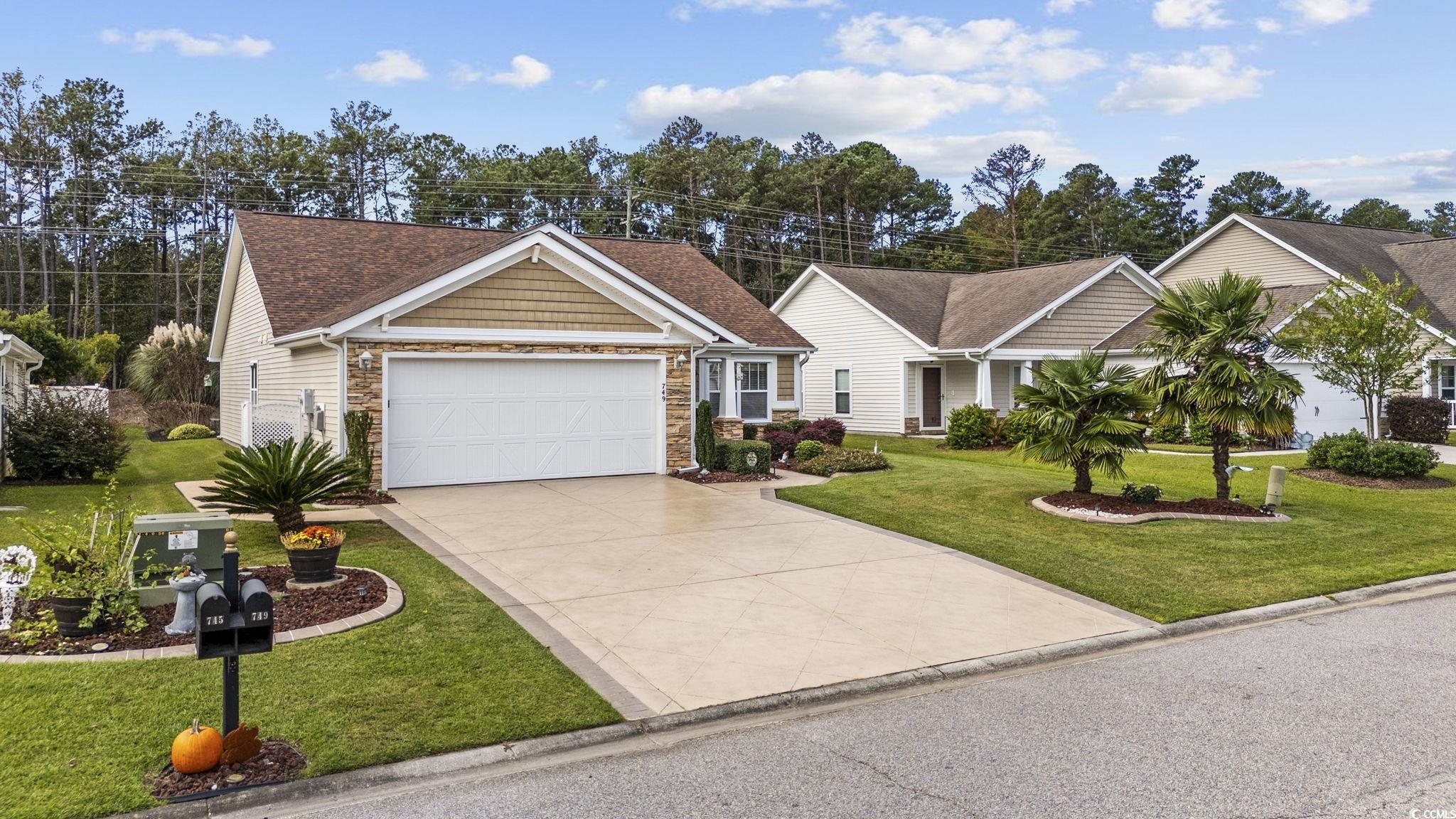 749 Bonita Loop Myrtle Beach, SC 29588 - Photo 3 of 37 View of front facade with a front yard and a garag