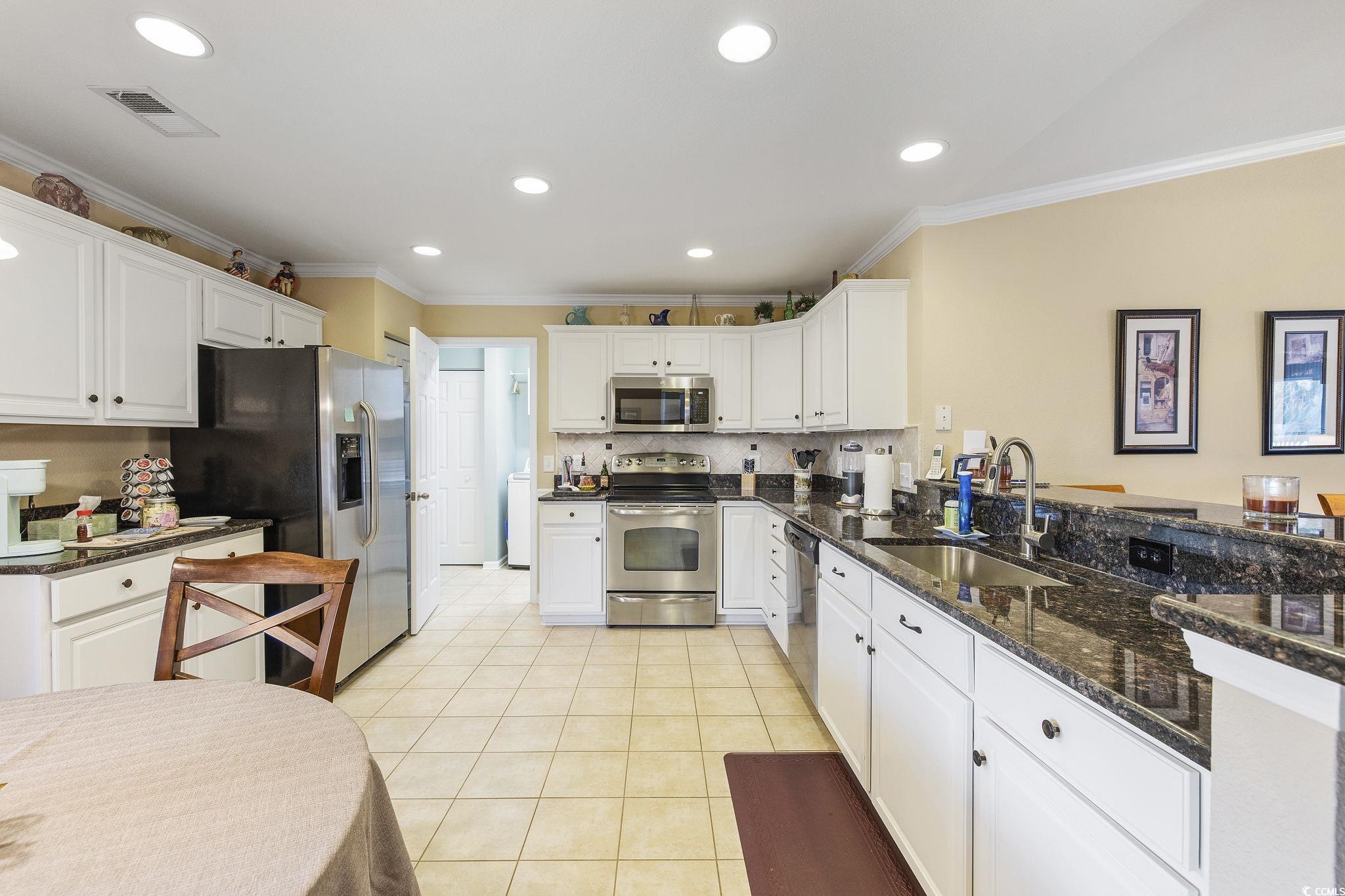 749 Bonita Loop Myrtle Beach, SC 29588 - Photo 8 of 37 Kitchen with stainless steel appliances, crown mol