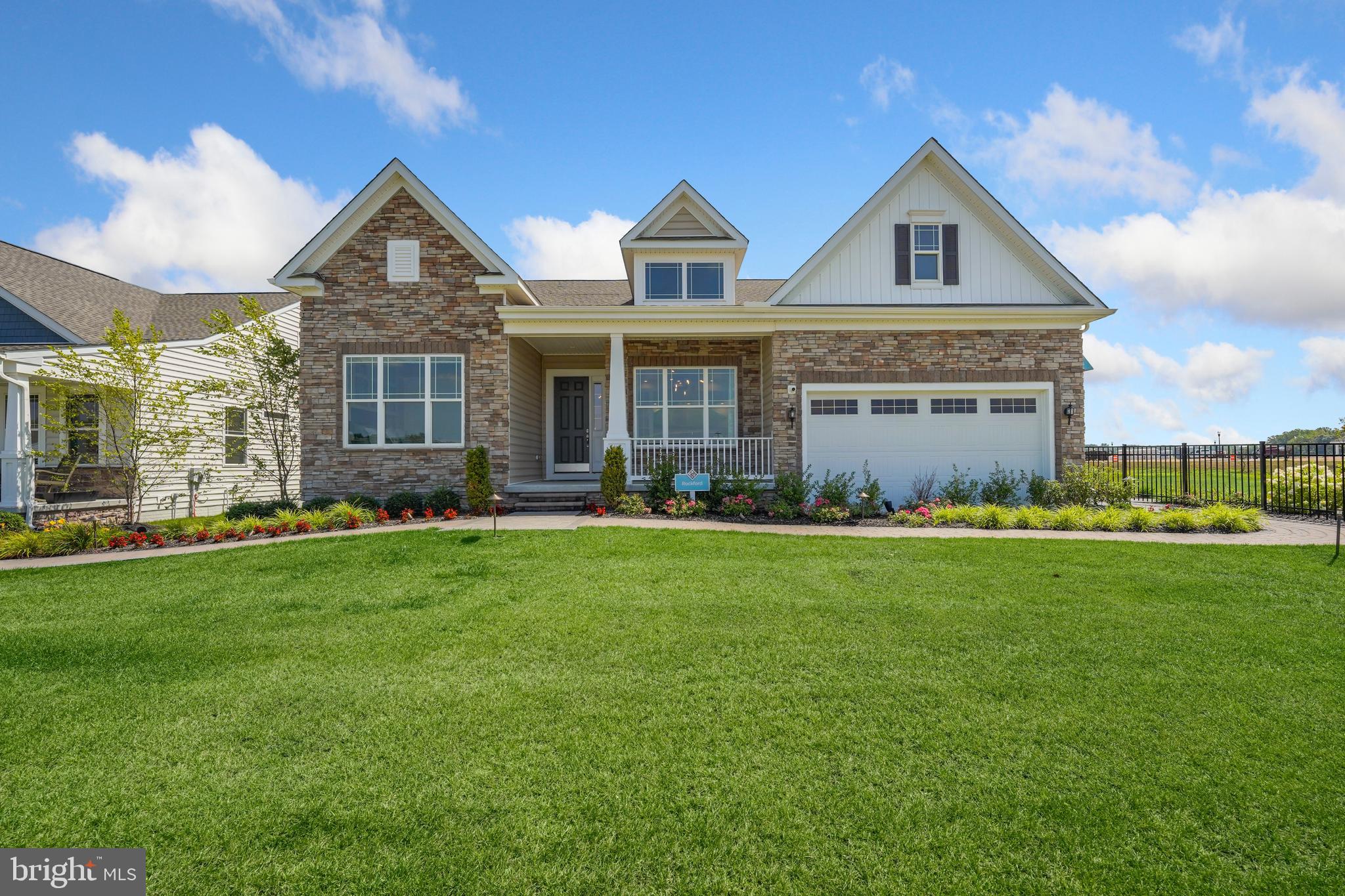 772 Honey Locust Road Middletown, DE 19709 - Photo 1 of 18 a front view of a house with a yard