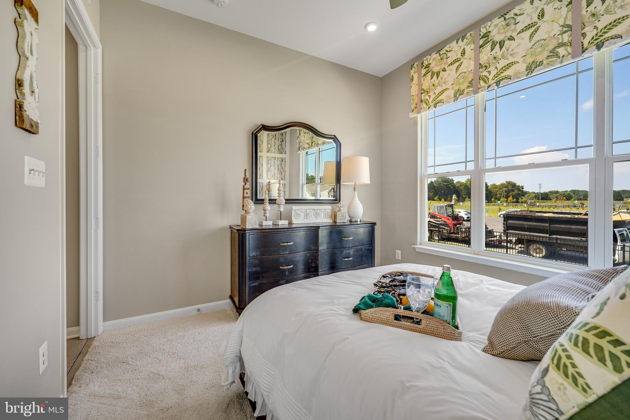 772 Honey Locust Road Middletown, DE 19709 - Photo 13 of 18 a bedroom with a bed and large windows