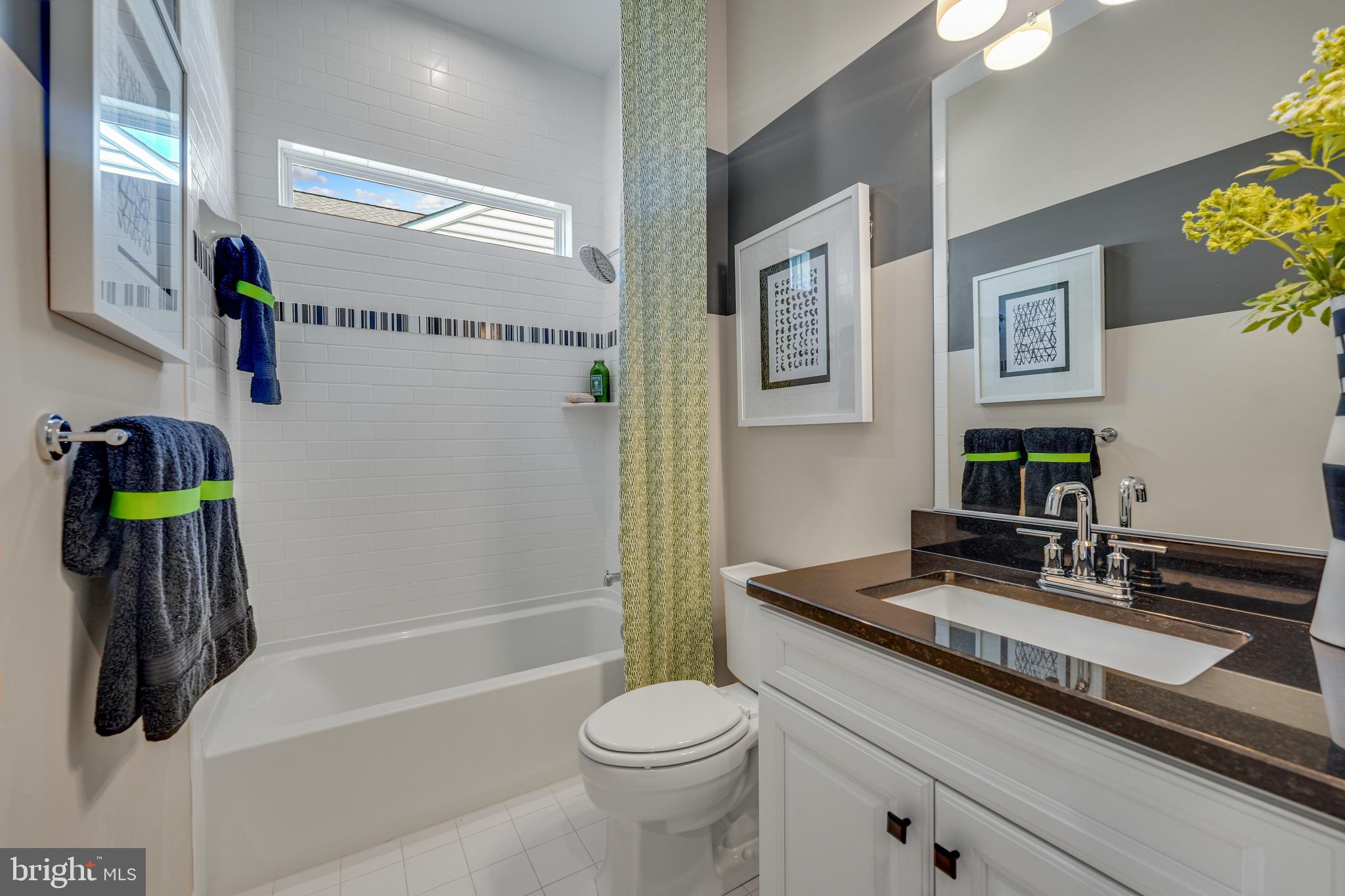 772 Honey Locust Road Middletown, DE 19709 - Photo 14 of 18 a bathroom with a sink a toilet and shower