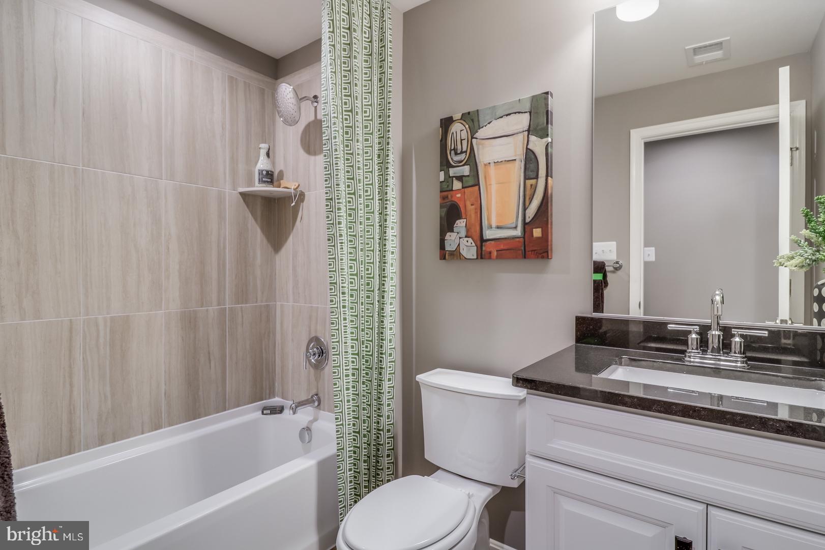 772 Honey Locust Road Middletown, DE 19709 - Photo 15 of 18 a bathroom with a granite countertop sink toilet and shower