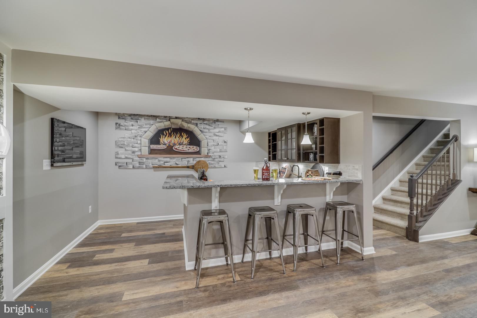 772 Honey Locust Road Middletown, DE 19709 - Photo 16 of 18 a view of a kitchen with furniture and wooden floor