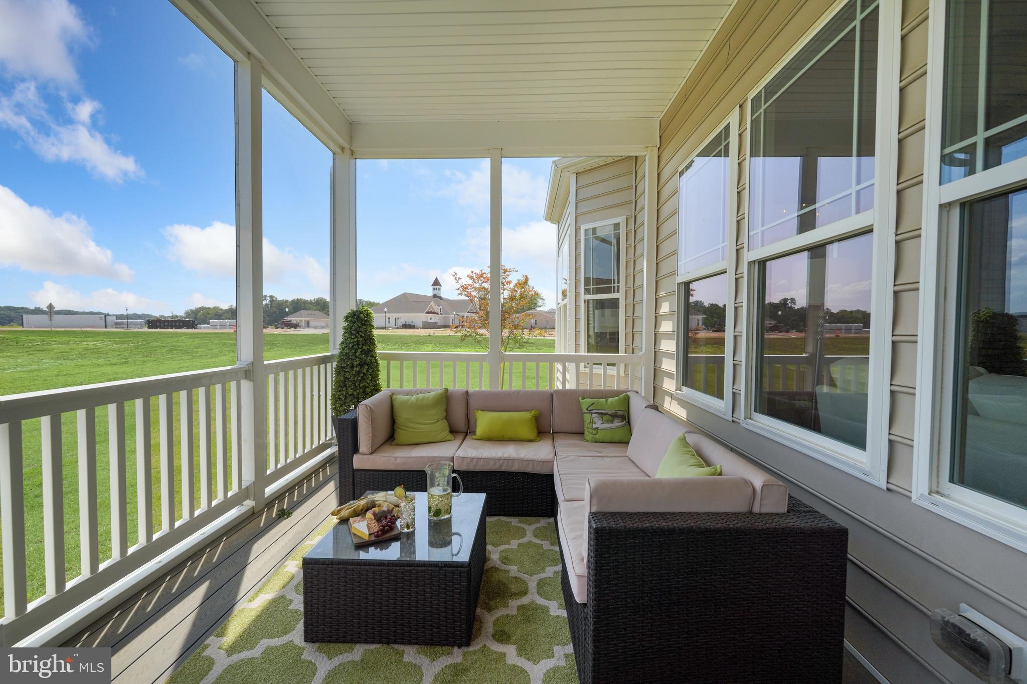 772 Honey Locust Road Middletown, DE 19709 - Photo 18 of 18 a balcony with furniture and a garden