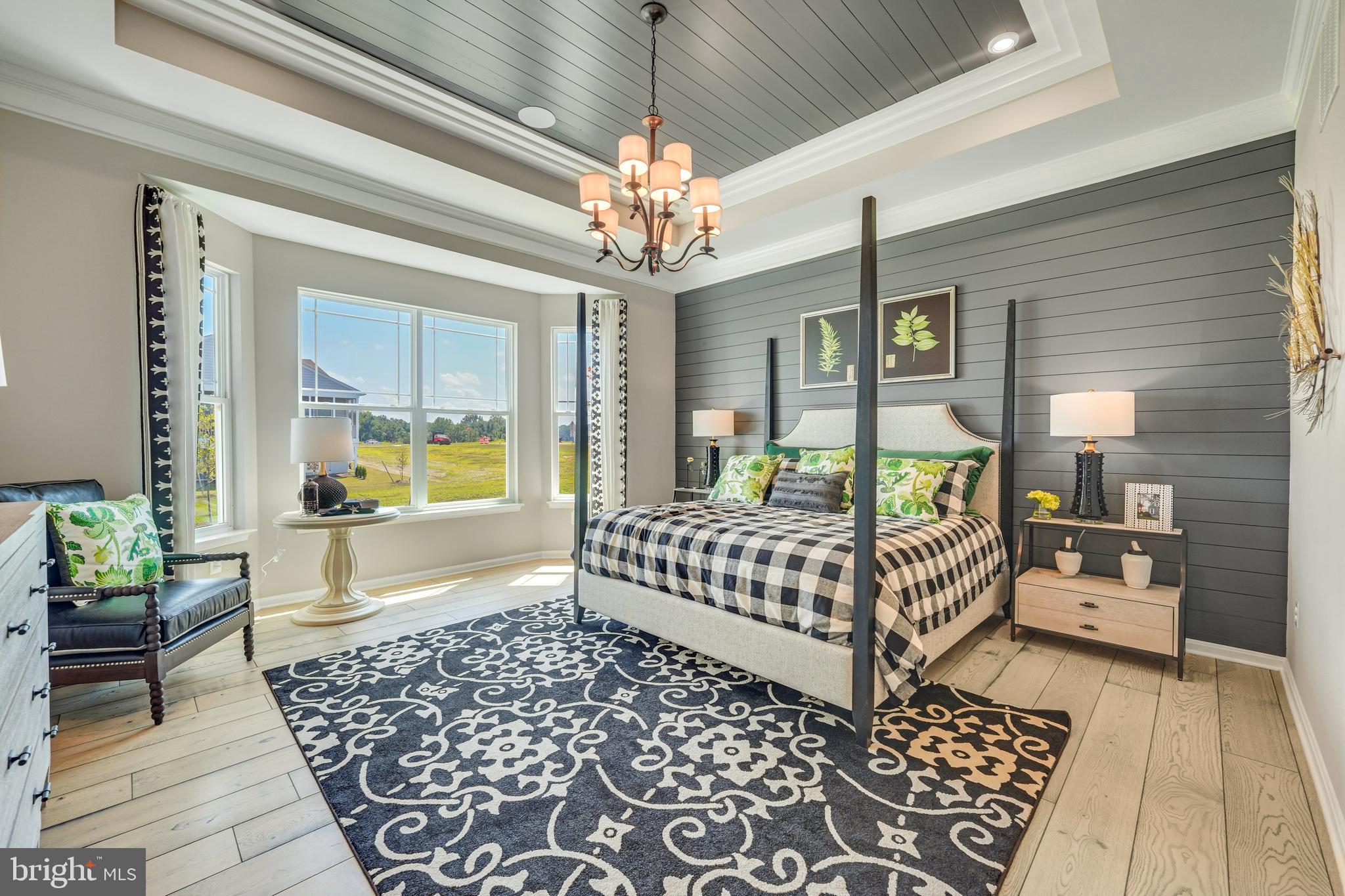 772 Honey Locust Road Middletown, DE 19709 - Photo 6 of 18 a bedroom with furniture and a chandelier