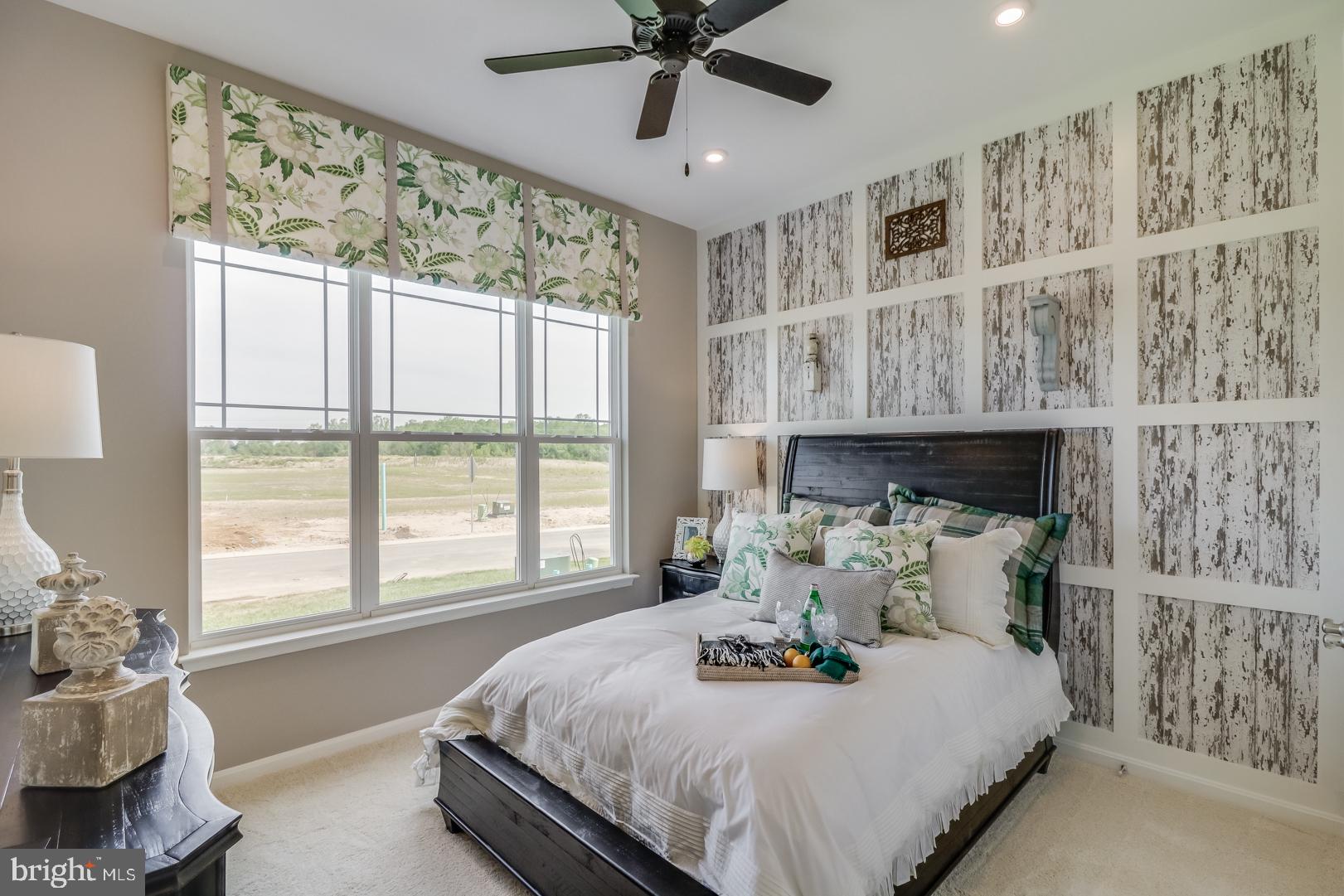 772 Honey Locust Road Middletown, DE 19709 - Photo 8 of 18 a bedroom with a large bed and a window