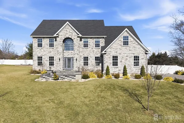 front view of a house with a yard