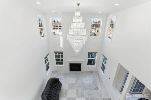 a view of living room with furniture and fireplace