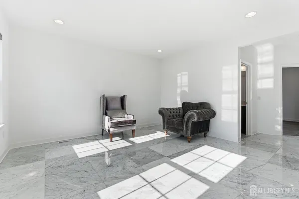 a living room with a couch and a rug