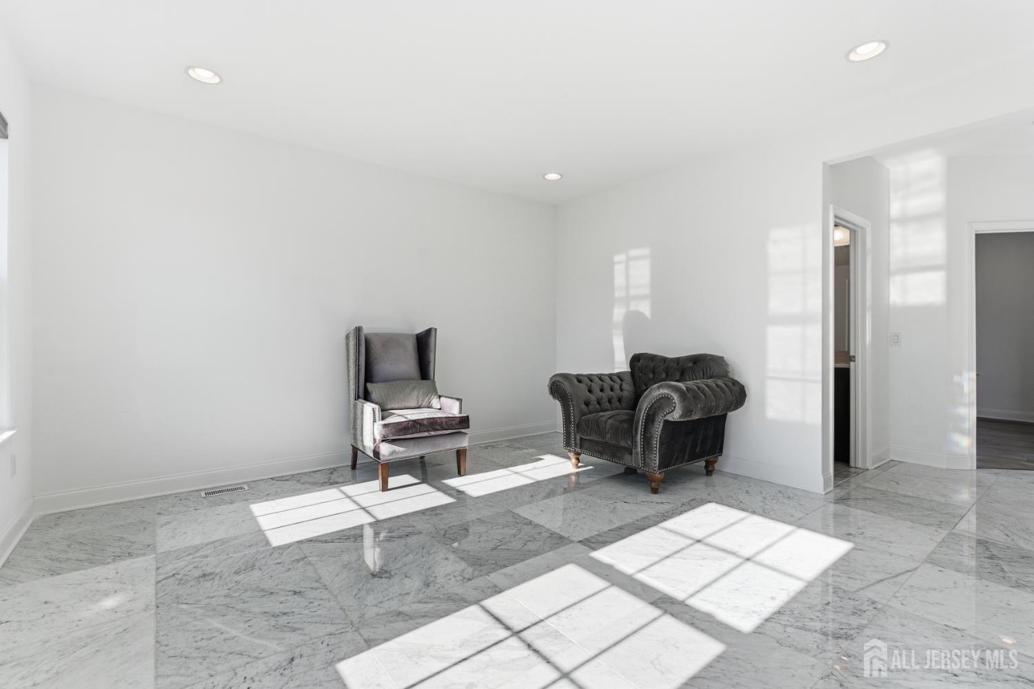 29 May Road East Brunswick, NJ 08816 - Photo 12 of 48 a living room with a couch and a rug