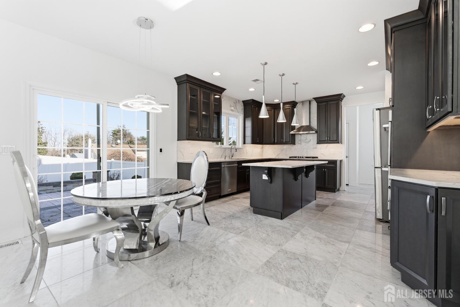 29 May Road East Brunswick, NJ 08816 - Photo 14 of 48 a room with stainless steel appliances kitchen island granite countertop a sink and a refrigerator
