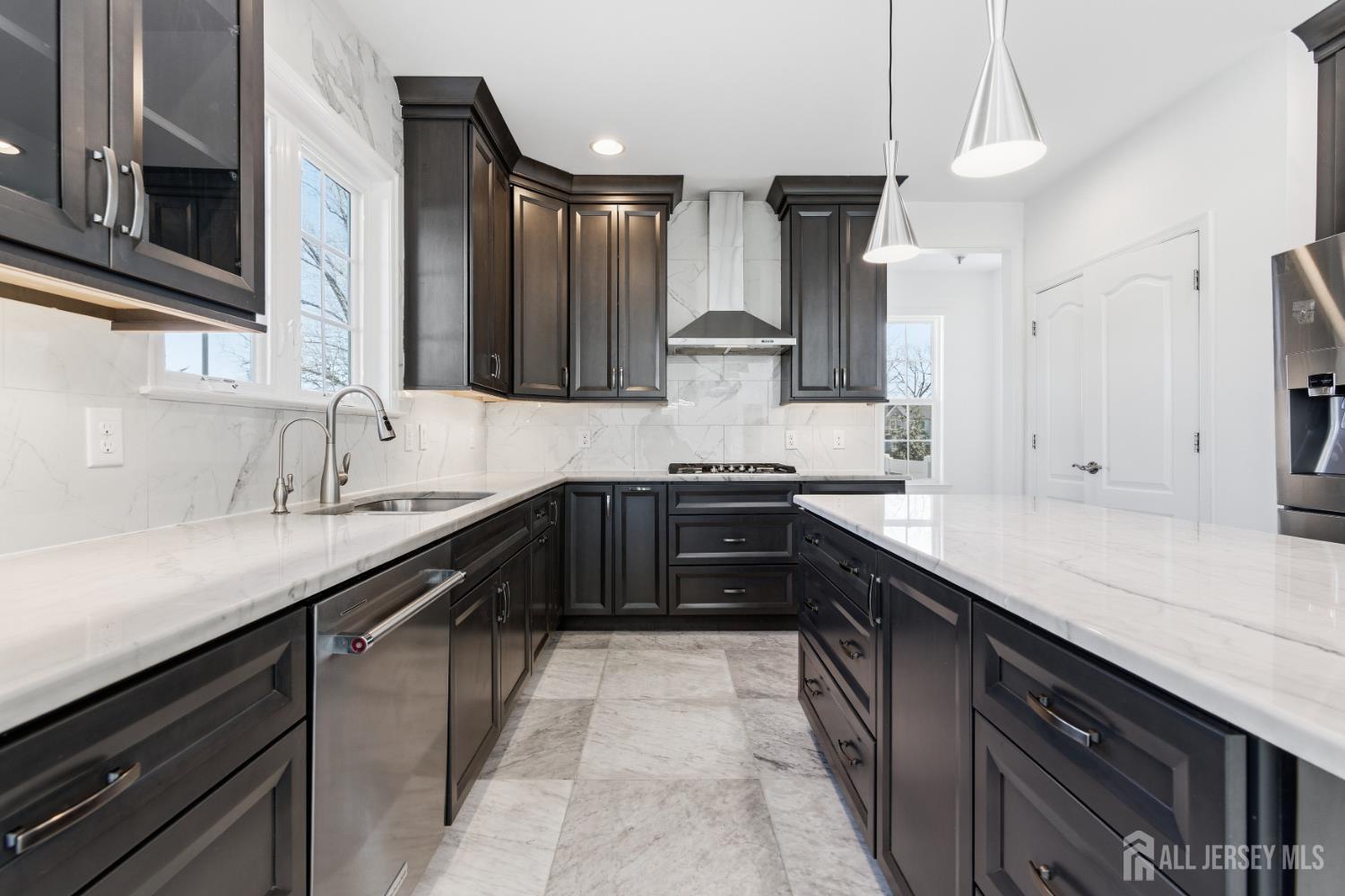 29 May Road East Brunswick, NJ 08816 - Photo 19 of 48 a kitchen with a sink and a stove top oven