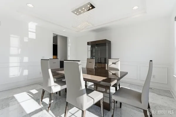 a view of a dining room with furniture and window