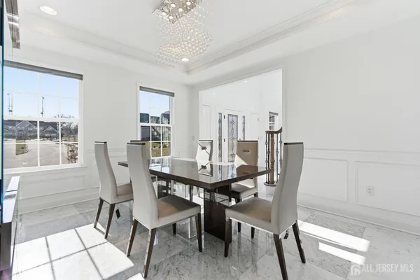 a view of a dining room with furniture and window