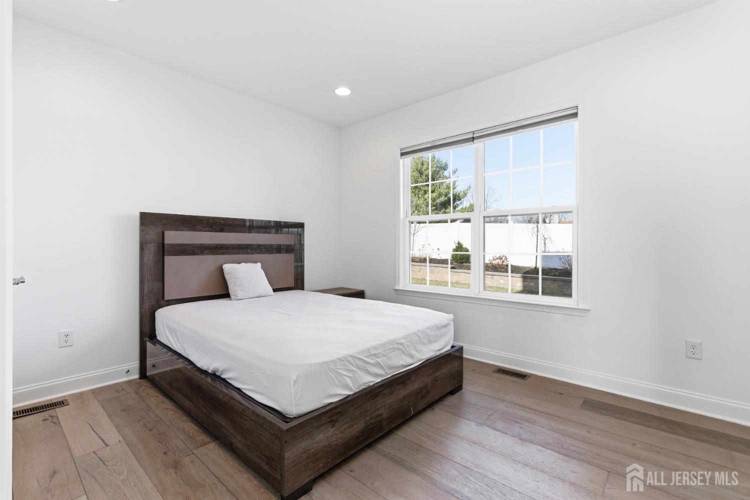 29 May Road East Brunswick, NJ 08816 - Photo 22 of 48 a bed sitting in a bedroom next to a window