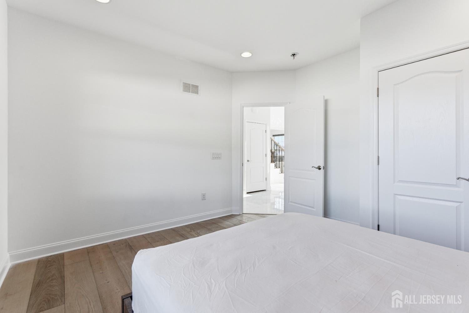 29 May Road East Brunswick, NJ 08816 - Photo 23 of 48 a bedroom with a bed and closet