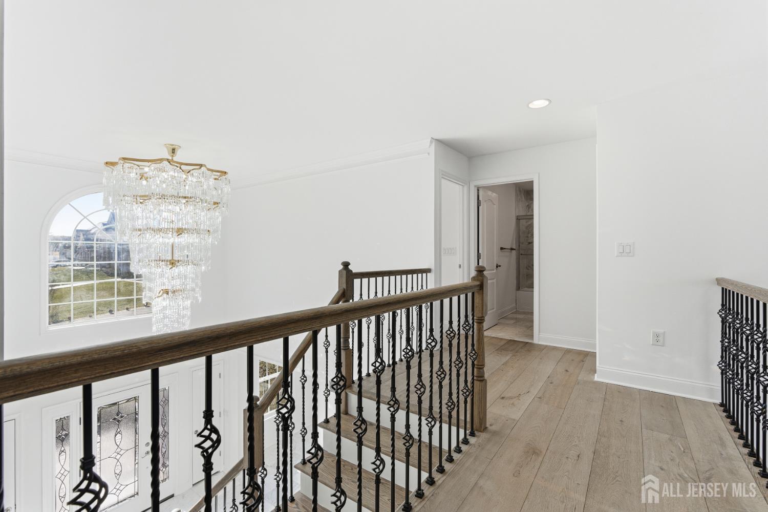 29 May Road East Brunswick, NJ 08816 - Photo 26 of 48 a view of a hallway with wooden floor and staircase