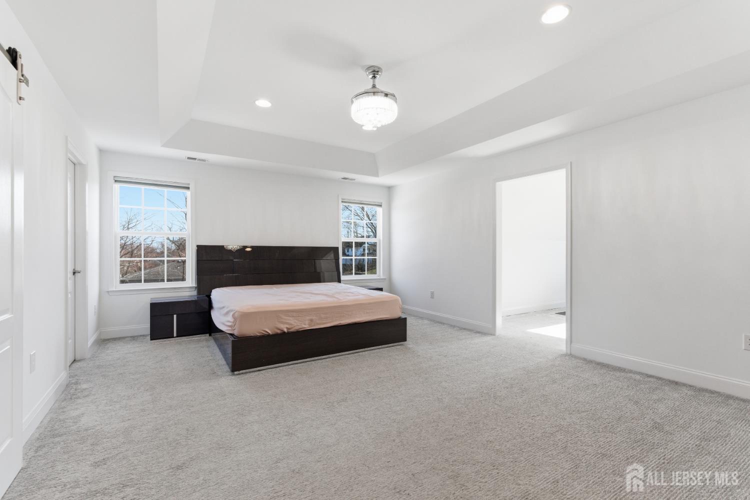 29 May Road East Brunswick, NJ 08816 - Photo 27 of 48 a spacious bedroom with a bed and window