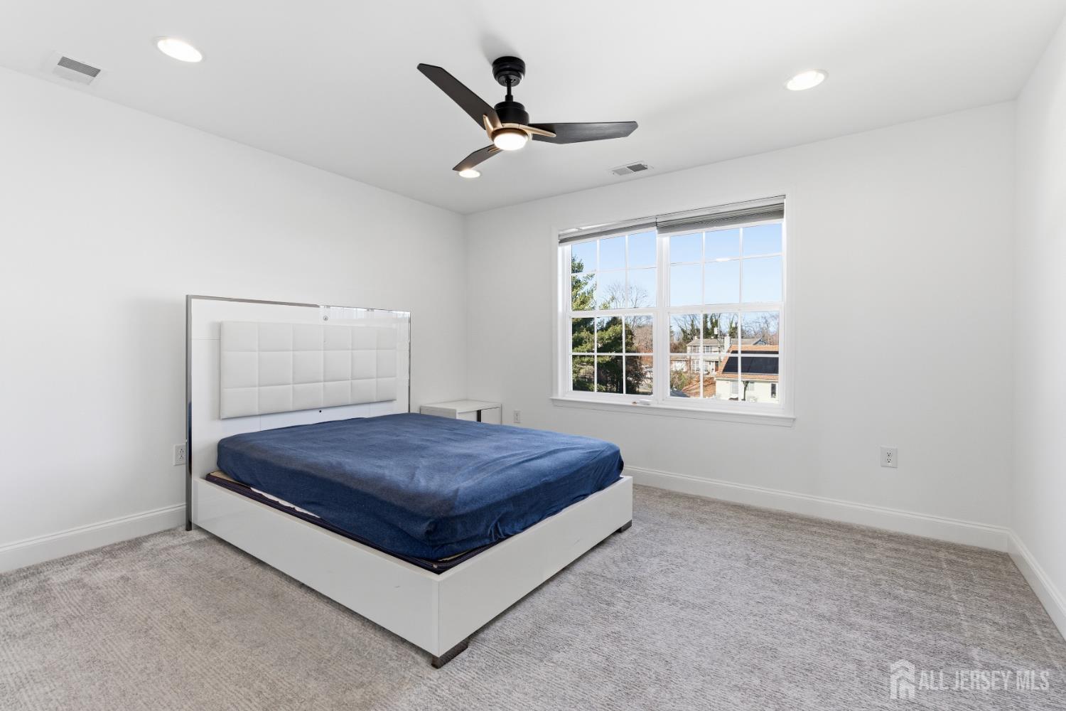 29 May Road East Brunswick, NJ 08816 - Photo 32 of 48 a living room with a window and a ceiling fan