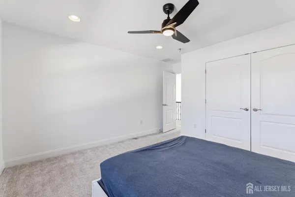 an empty room with a ceiling fan