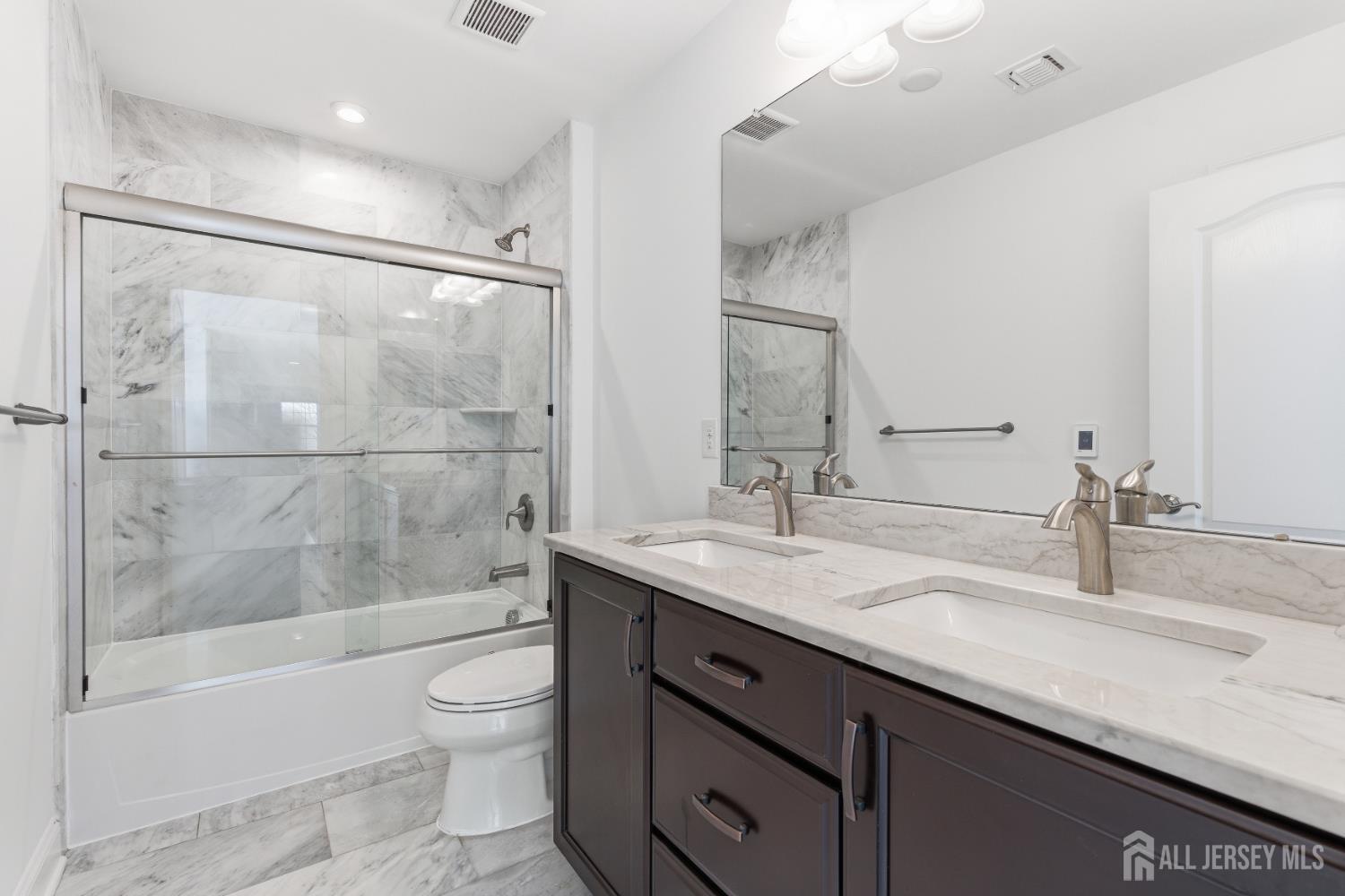 29 May Road East Brunswick, NJ 08816 - Photo 37 of 48 a bathroom with a granite countertop sink toilet and shower