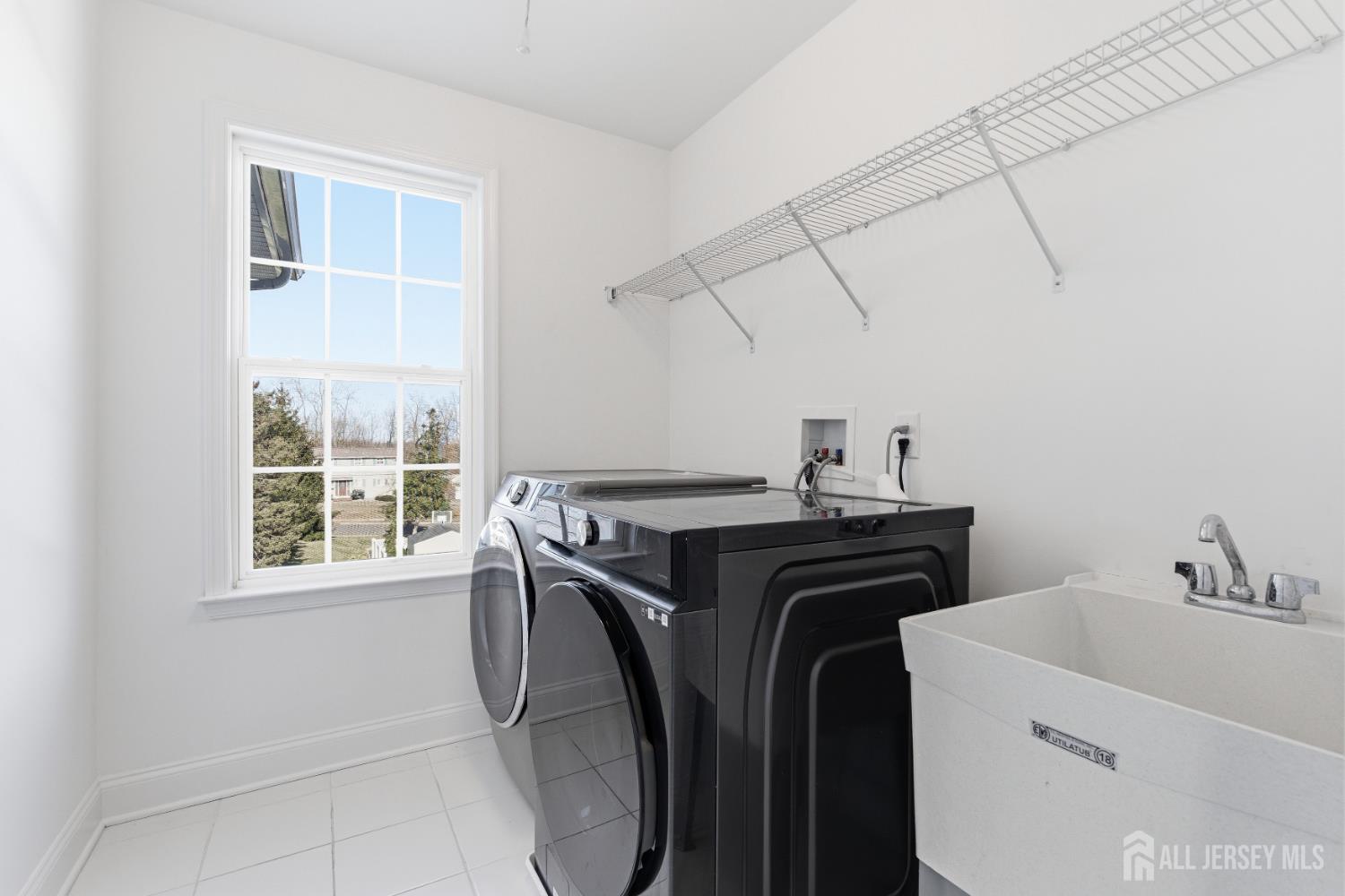 29 May Road East Brunswick, NJ 08816 - Photo 38 of 48 a utility room with dryer and washer