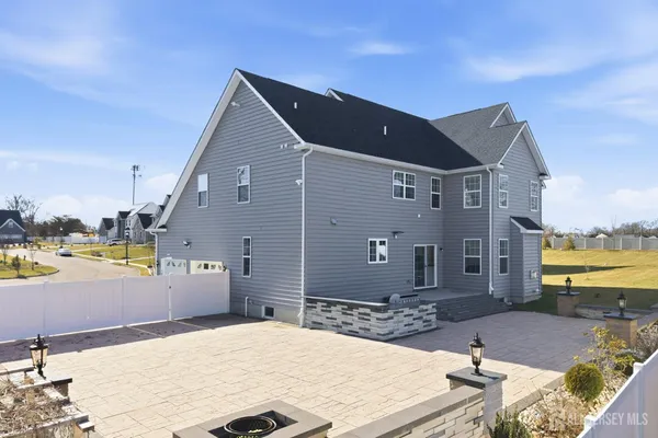 a terrace of a house with outdoor seating