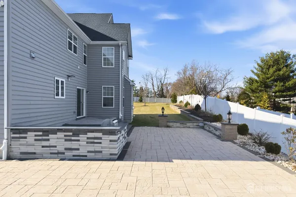 a view of a backyard with sitting area