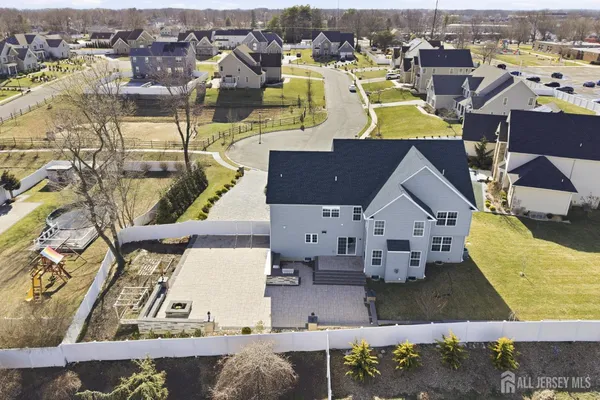 an aerial view of a house with a swimming pool