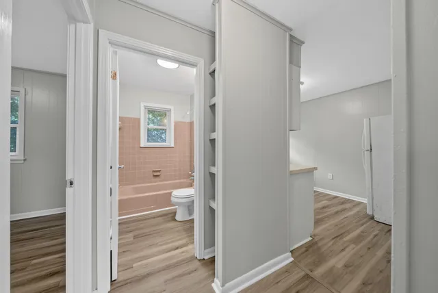 a view of a bathroom from a hallway