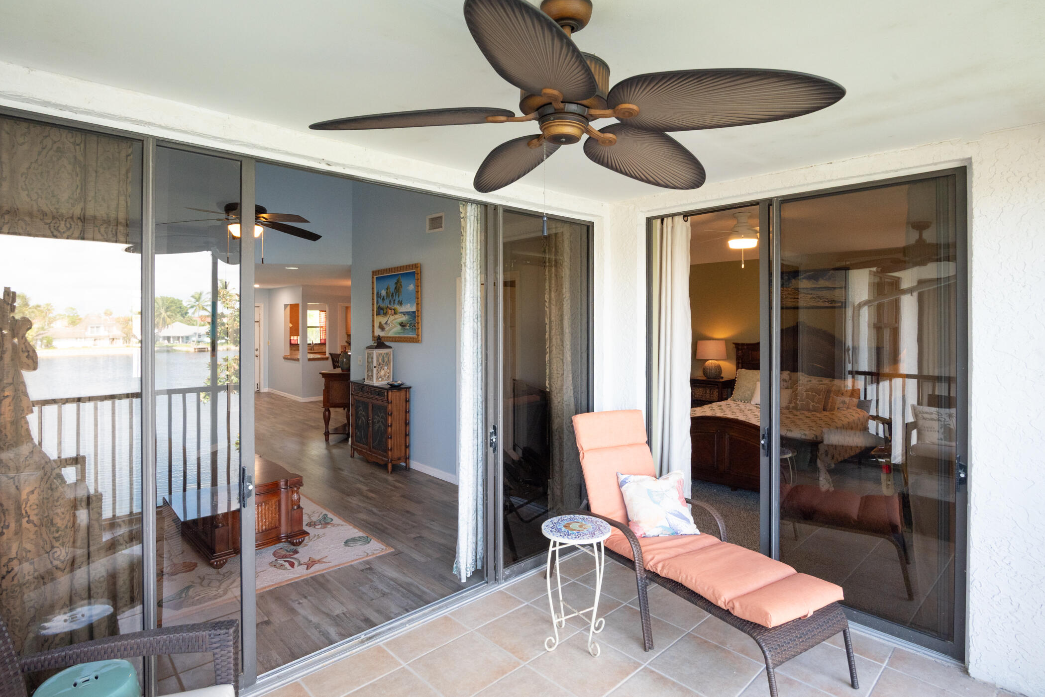 6041 Southeast Landing Way, Unit 17 Stuart, FL 34997 - Photo 26 of 37 a living room with furniture and a ceiling fan