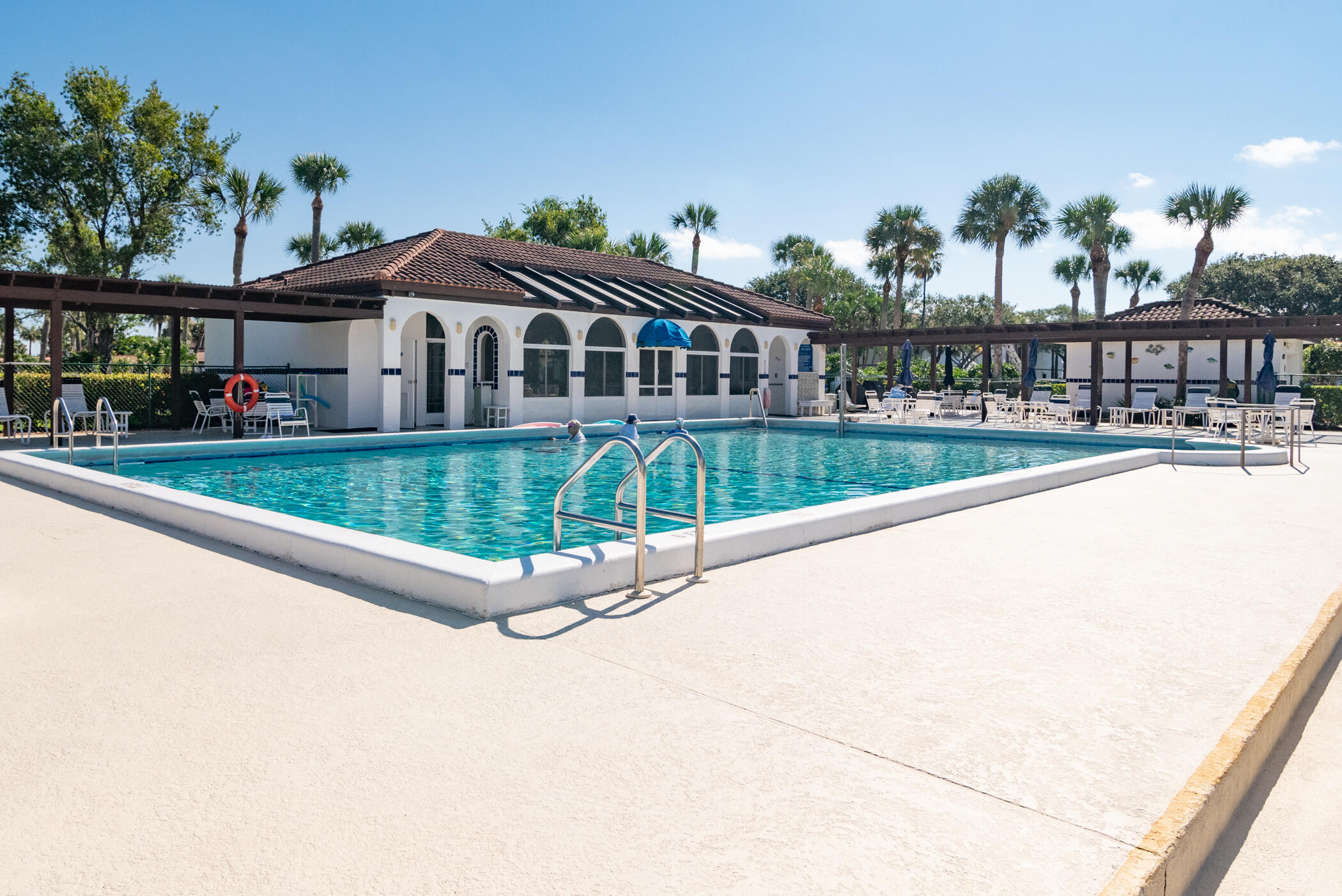 6041 Southeast Landing Way, Unit 17 Stuart, FL 34997 - Photo 29 of 37 a view of a house with a yard and potted plants