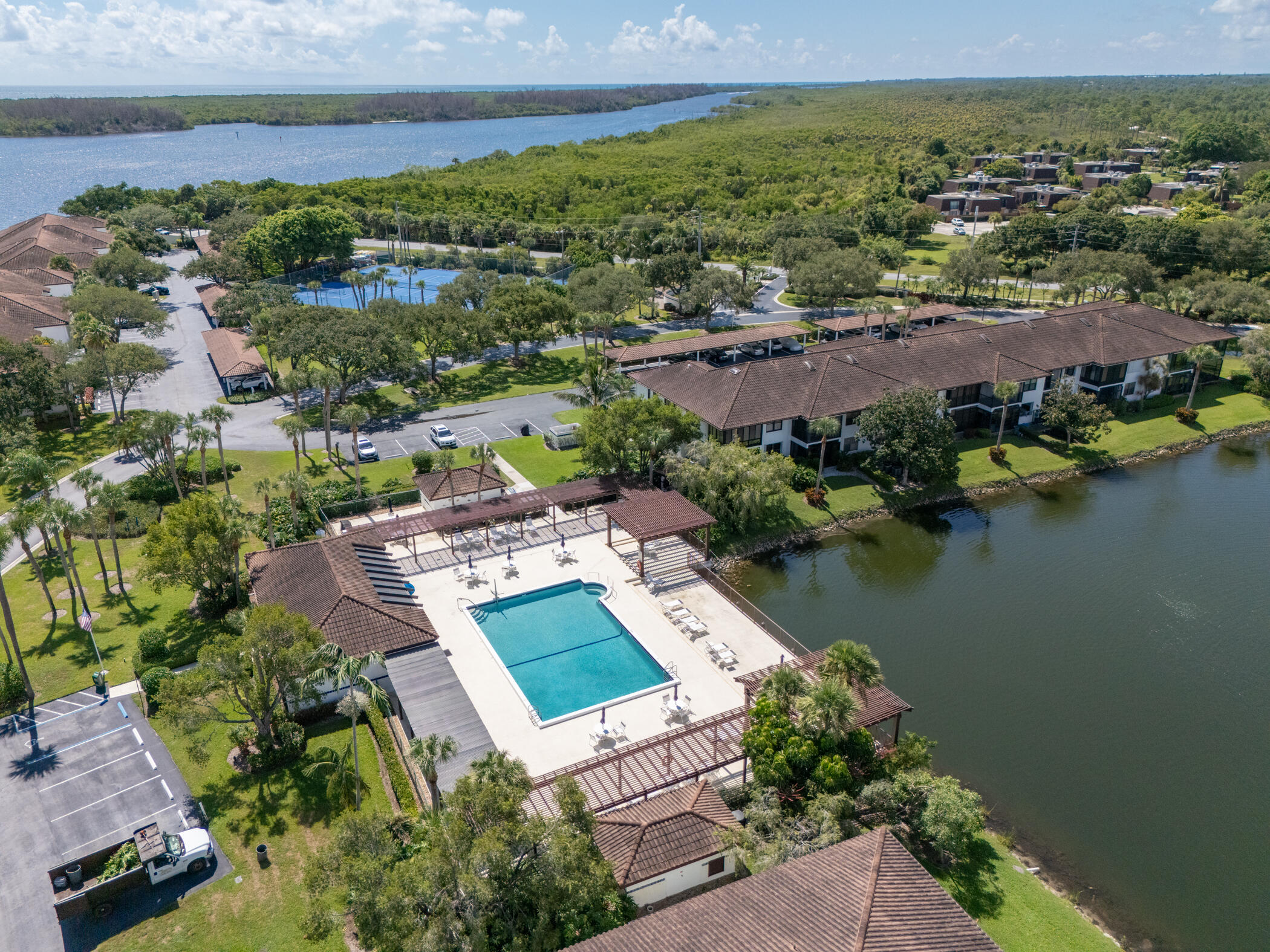 6041 Southeast Landing Way, Unit 17 Stuart, FL 34997 - Photo 35 of 37 an aerial view of residential houses with outdoor space