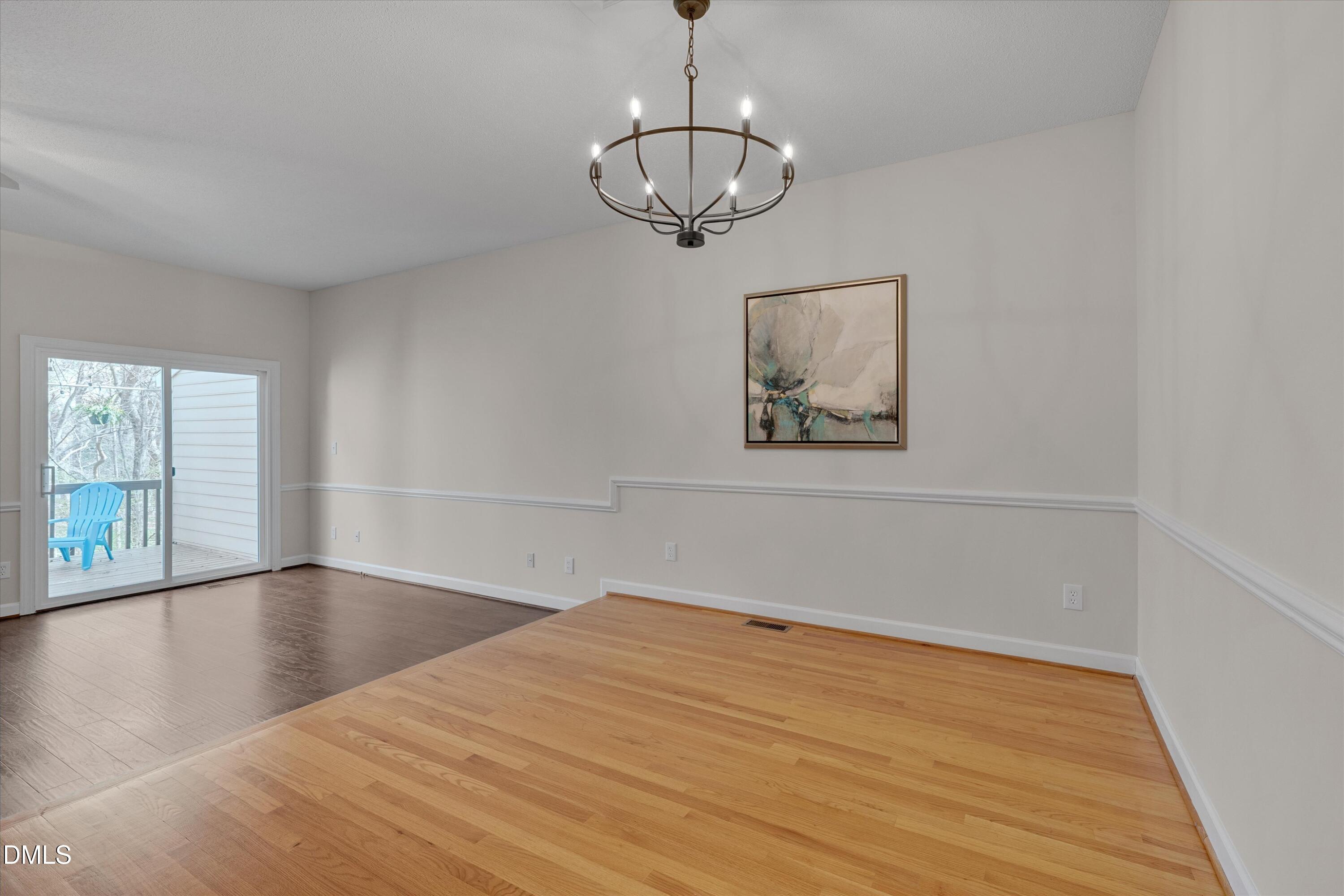 3 Preakness Drive Durham, NC 27713 - Photo 11 of 62 a view of empty room with wooden floor and fan