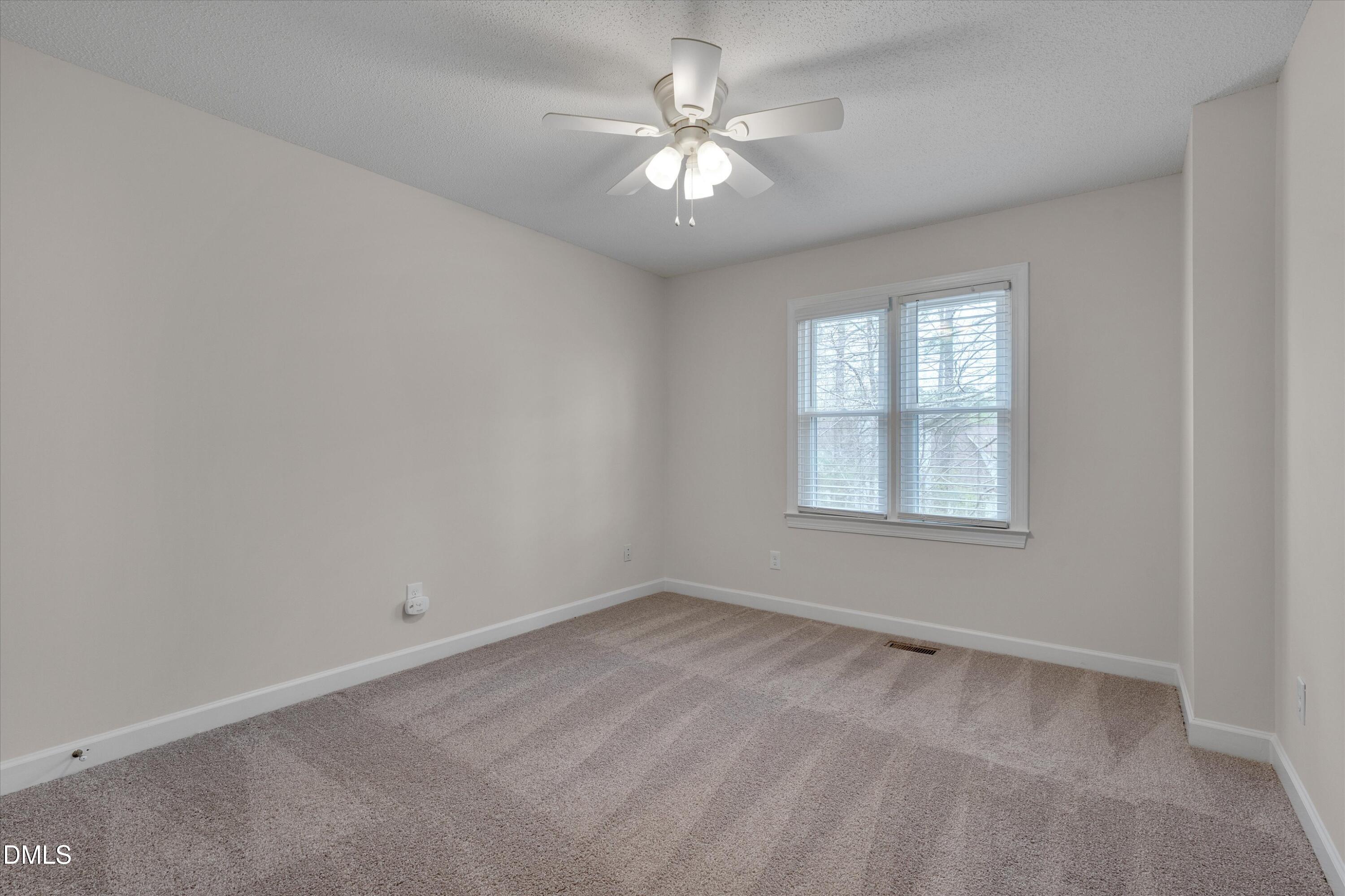 3 Preakness Drive Durham, NC 27713 - Photo 32 of 62 an empty room with windows and ceiling fan