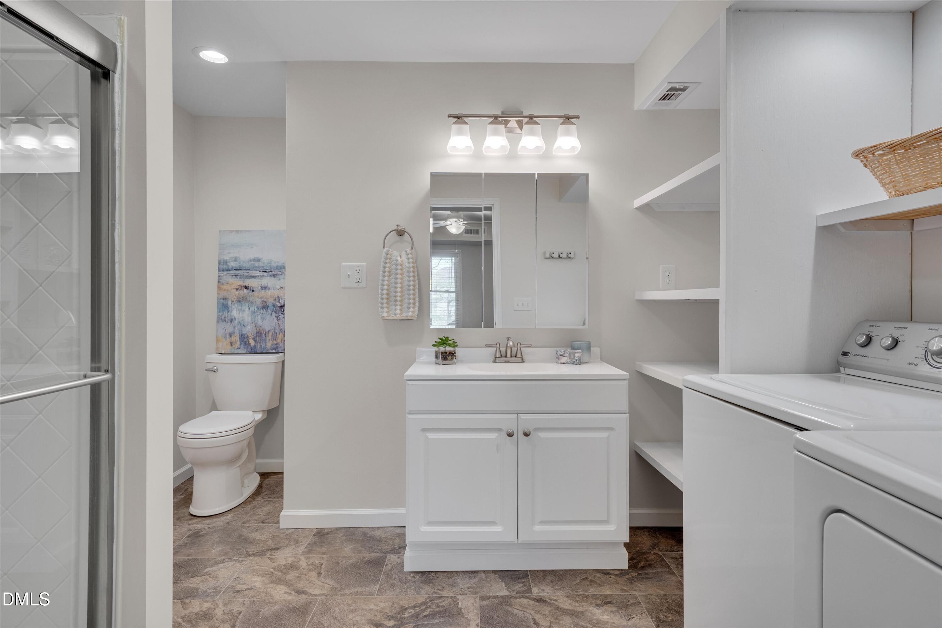 3 Preakness Drive Durham, NC 27713 - Photo 42 of 62 a view of bathroom with a toilet sink and mirror