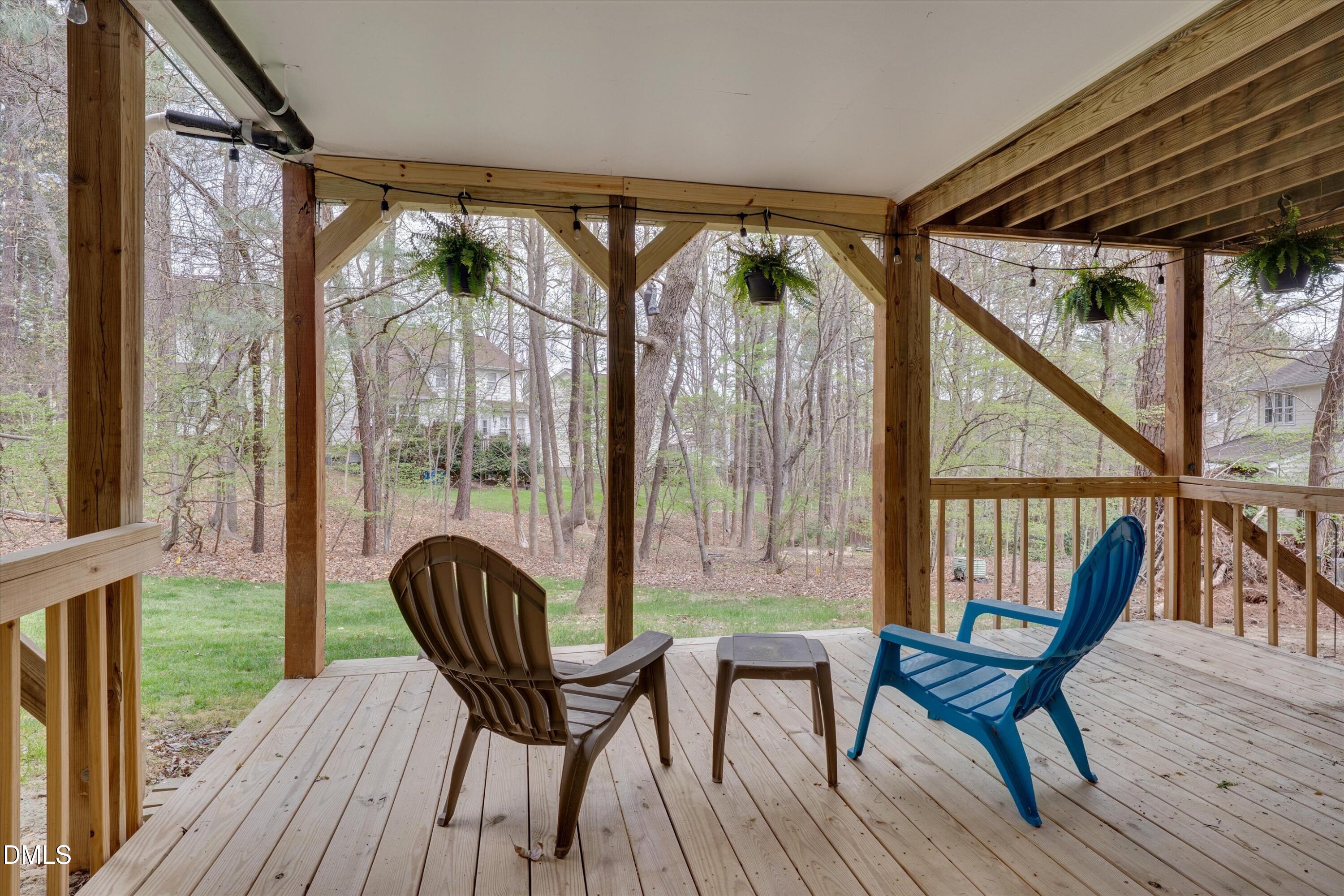 3 Preakness Drive Durham, NC 27713 - Photo 44 of 62 a view of a porch with furniture and wooden floor
