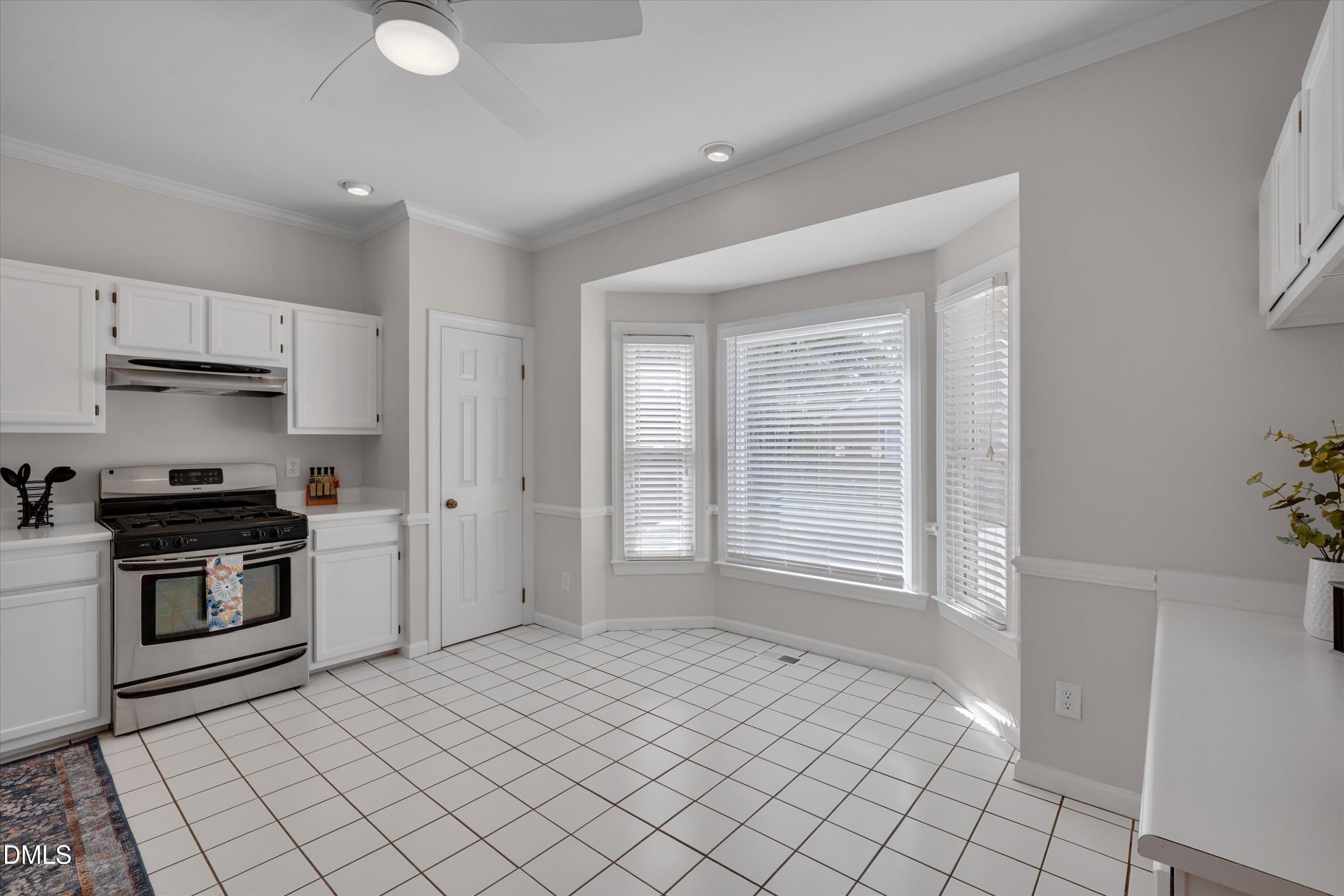 3 Preakness Drive Durham, NC 27713 - Photo 5 of 62 a kitchen with stainless steel appliances granite countertop a stove a sink and a refrigerator