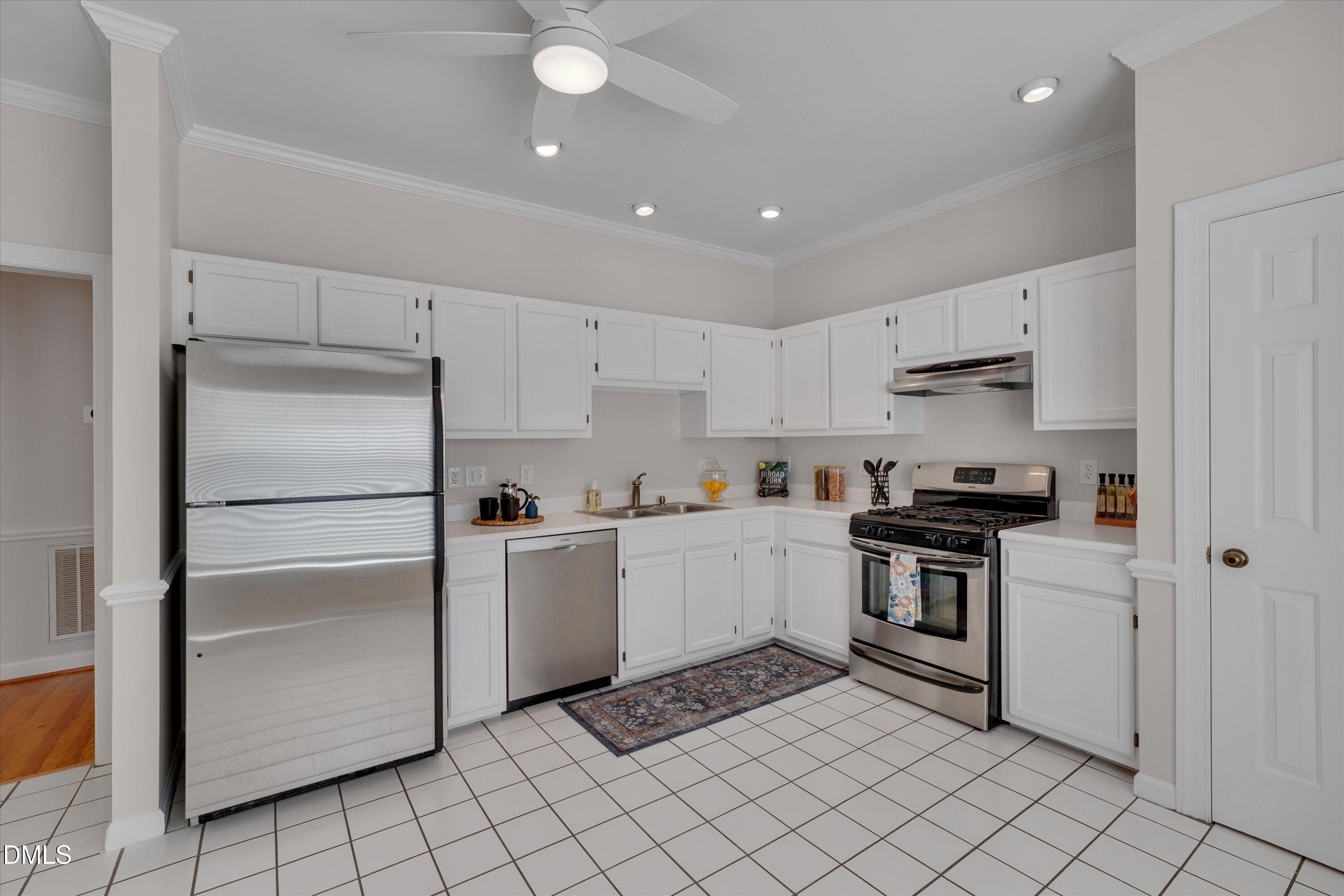 3 Preakness Drive Durham, NC 27713 - Photo 7 of 62 a kitchen with a stove top oven and cabinets