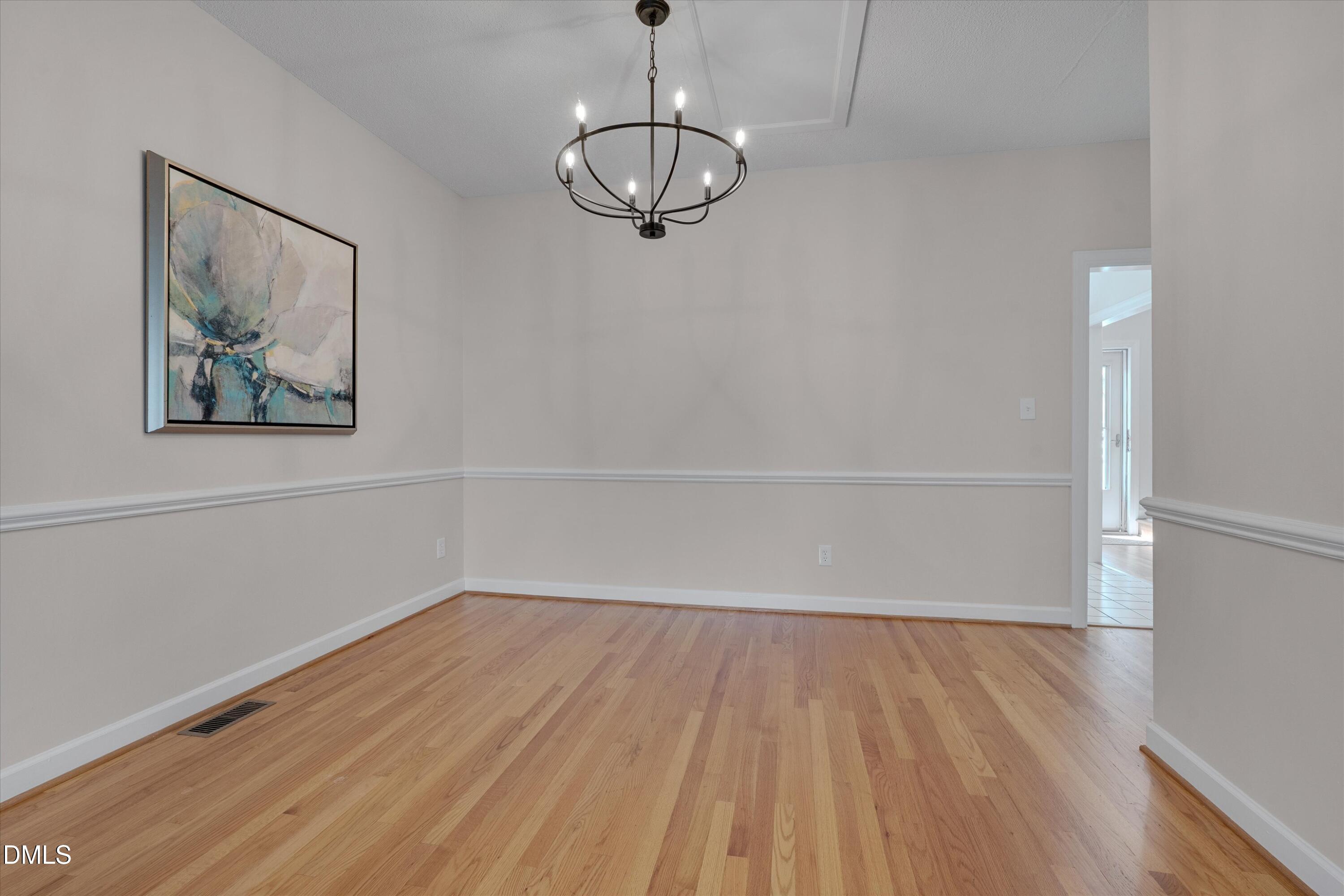 3 Preakness Drive Durham, NC 27713 - Photo 9 of 62 a view of a room with wooden floor and window