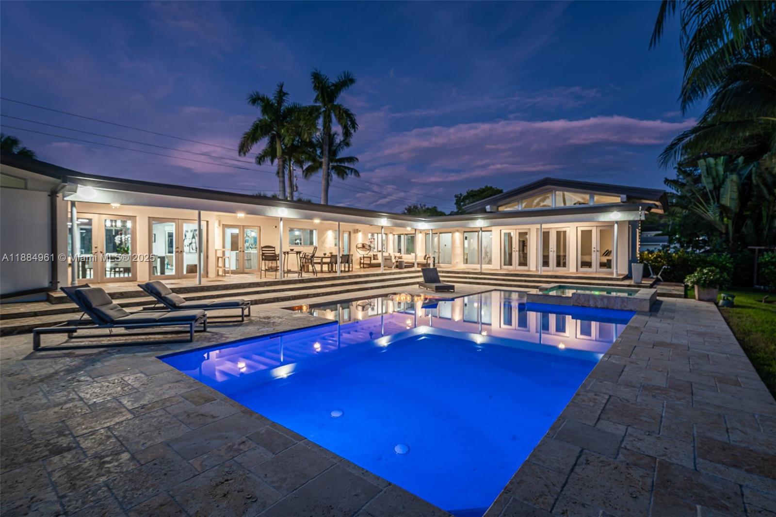 a view of swimming pool with a table and chairs