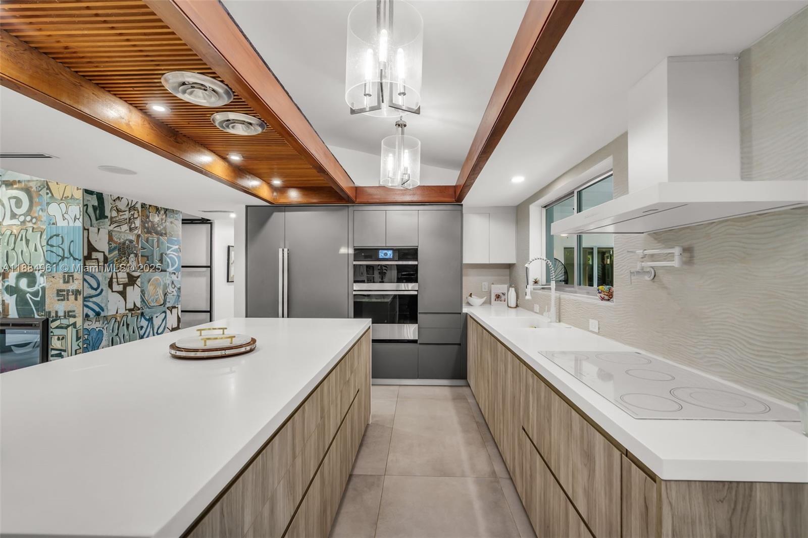 7550 Southwest 60th Street Miami, FL 33143 - Photo 11 of 64 a kitchen with kitchen island granite countertop lots of counter top space