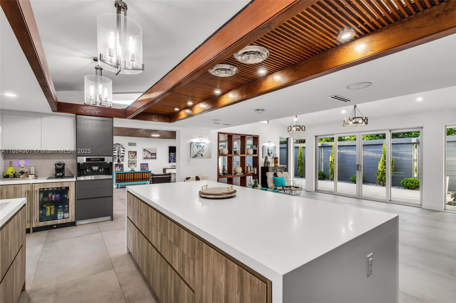 7550 Southwest 60th Street Miami, FL 33143 - Photo 12 of 64 a kitchen with stainless steel appliances granite countertop a sink and white cabinets