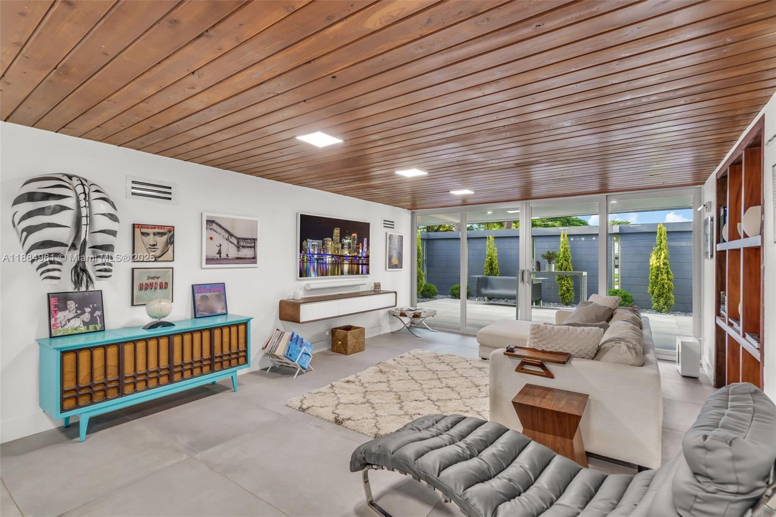 7550 Southwest 60th Street Miami, FL 33143 - Photo 14 of 64 a living room with furniture stairs and a large window