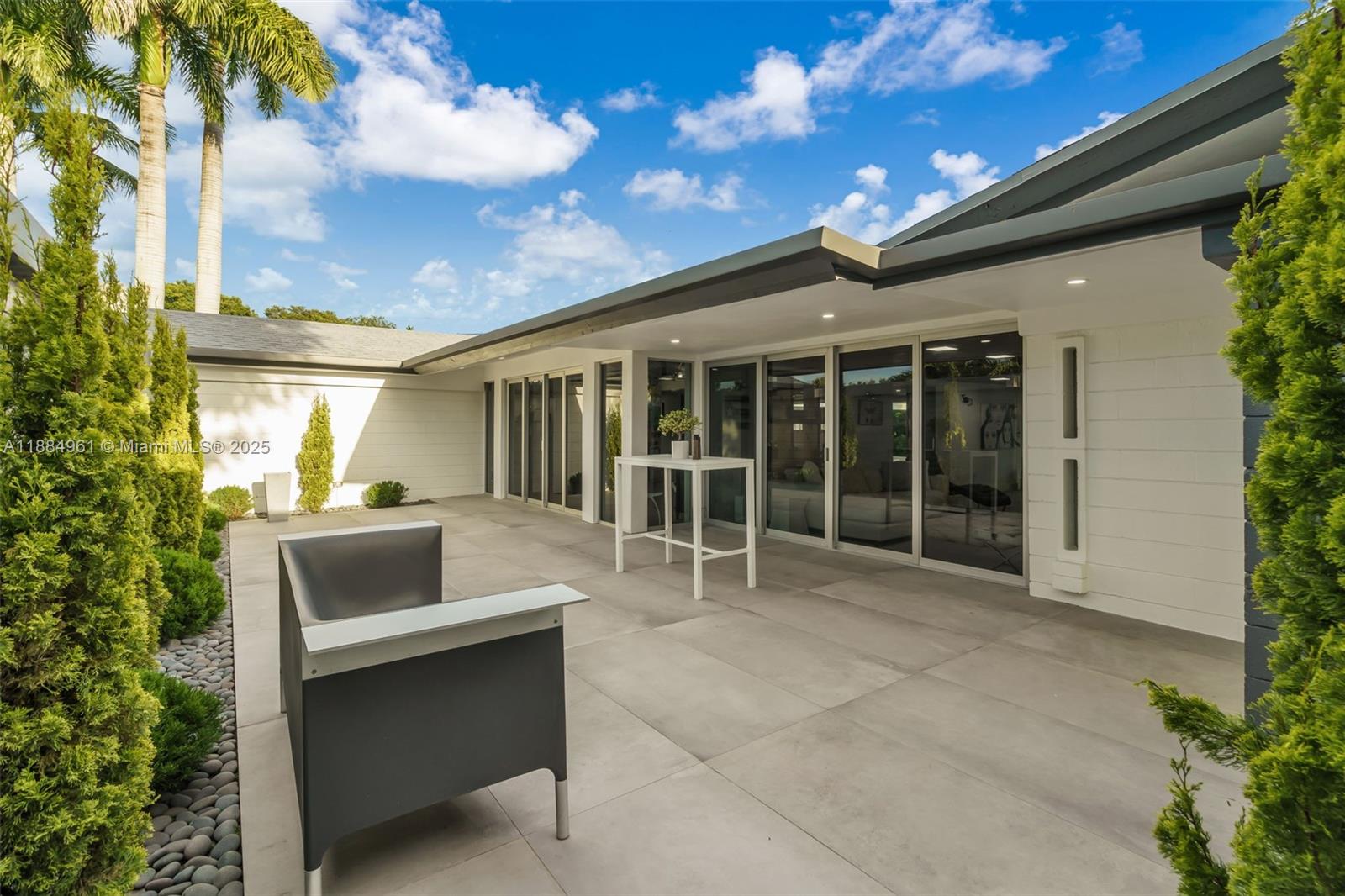 7550 Southwest 60th Street Miami, FL 33143 - Photo 15 of 64 a house view with a sitting space